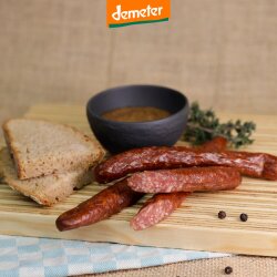 3 Kuhhorster Feuerbeißer auf Holzbrett