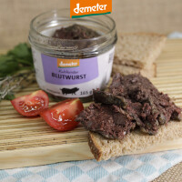 Holzbrett mit Kuhhorster Leberwurst im Glas, Tomanten und Brot
